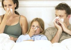 Sick family in bed